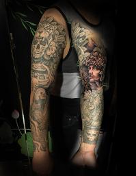 Aztec sleeve tattoo by Noe Lopez at Contra Tattoo Fresno